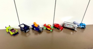 hot wheels cars lined up on table that were given as trophies to employees at retreat